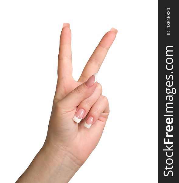 Women's hand shows the gesture of victory is isolated on a white background. Women's hand shows the gesture of victory is isolated on a white background.