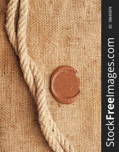 Wax seal and rope on sackcloth material