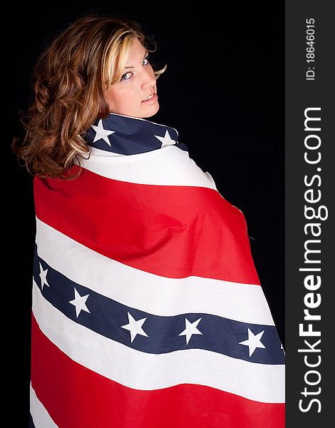 A peaceful young woman wrapped in a patriotic design. A peaceful young woman wrapped in a patriotic design.
