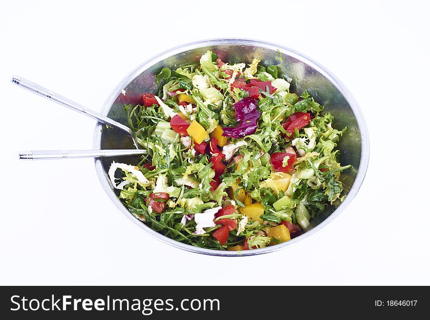 Salad with fresh lettuce leaves, tomatoes, red and yellow pepper, cucumber in a bowl isolated on white background. Salad with fresh lettuce leaves, tomatoes, red and yellow pepper, cucumber in a bowl isolated on white background