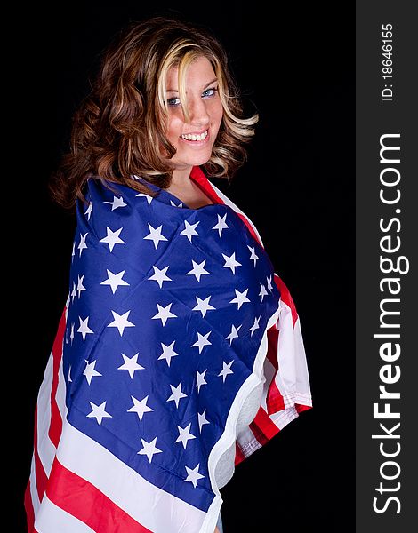 A beautiful women wrapped in an American Flag. A beautiful women wrapped in an American Flag.