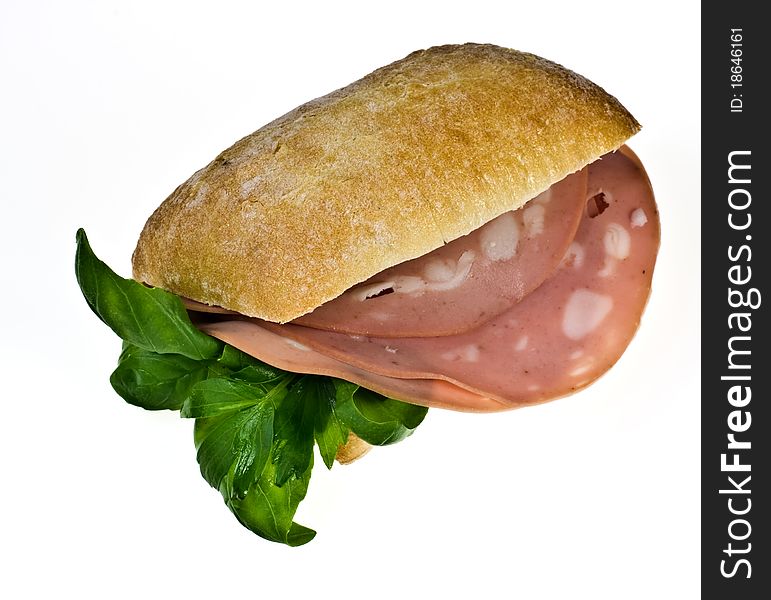 Ciabatta bread roll with mortadella and basil