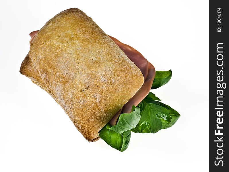 Ciabatta bread roll with mortadella and basil