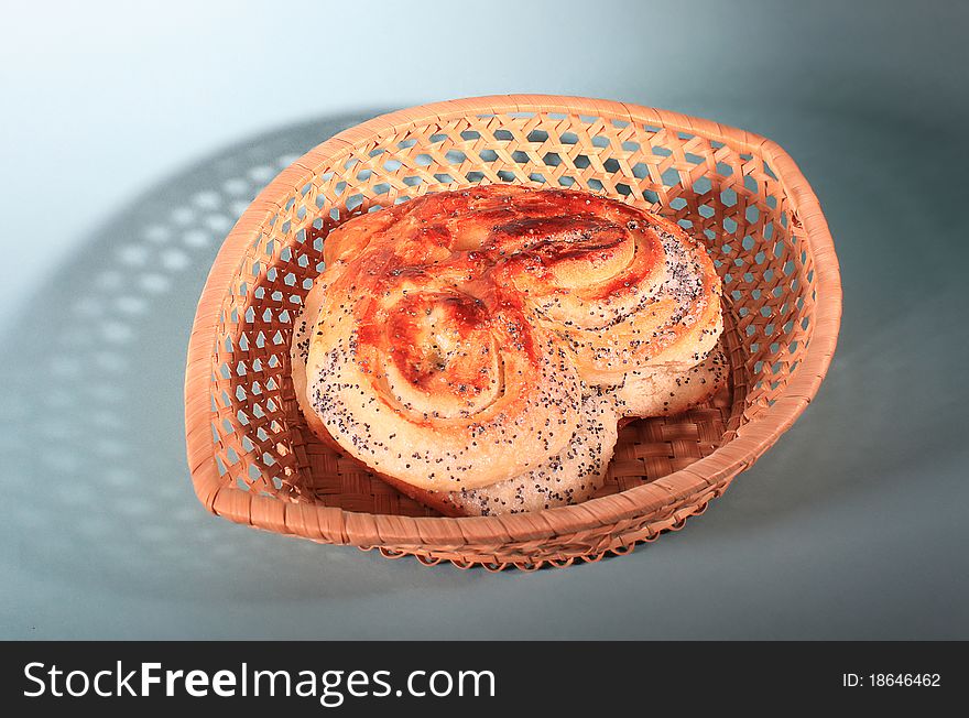 Sweet heart bread with poppie seeds in a basket.