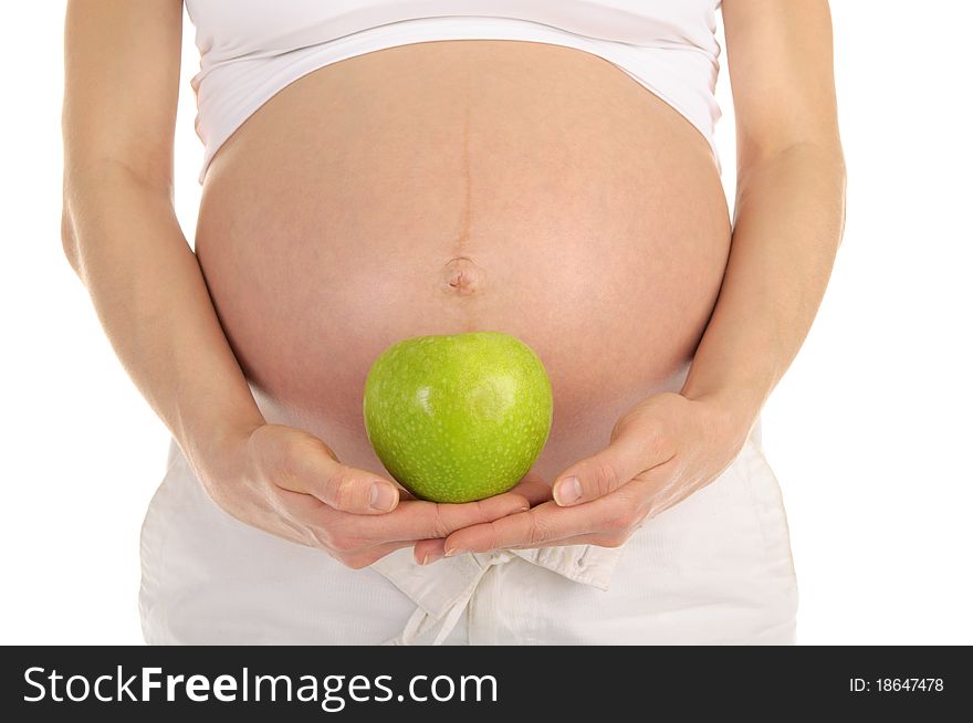 Pregnant woman belly with apple isolated on white