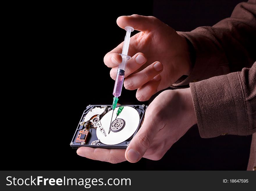 Conceptual photo of repairing hard disc with surgical needle. Conceptual photo of repairing hard disc with surgical needle.