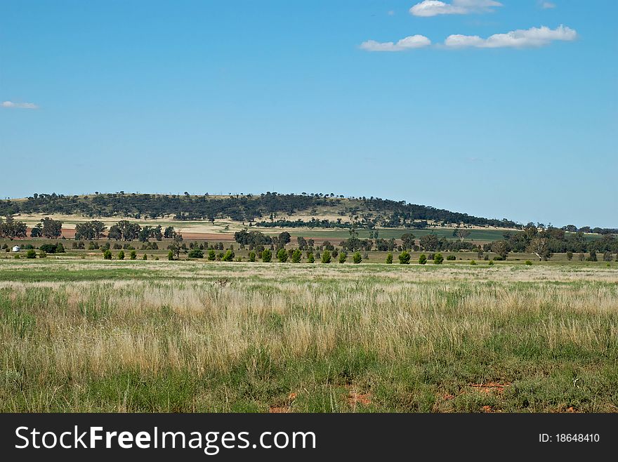 Farm land at the foot of a hill. Farm land at the foot of a hill