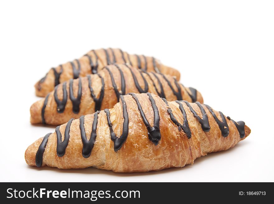 Croissant with chocolate onto white background