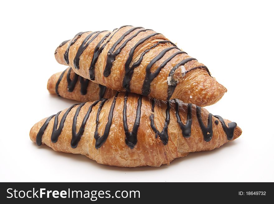 Croissant with chocolate onto white background