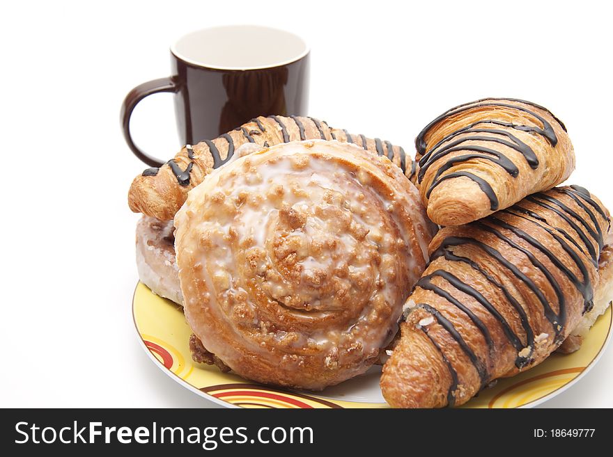 Pastry onto plates with coffee cup