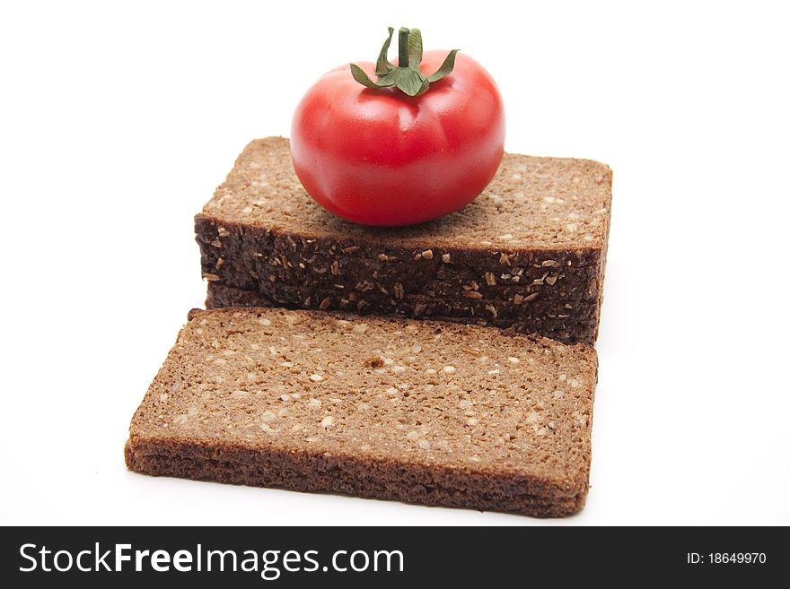 Tomato on wholemeal bread with white background