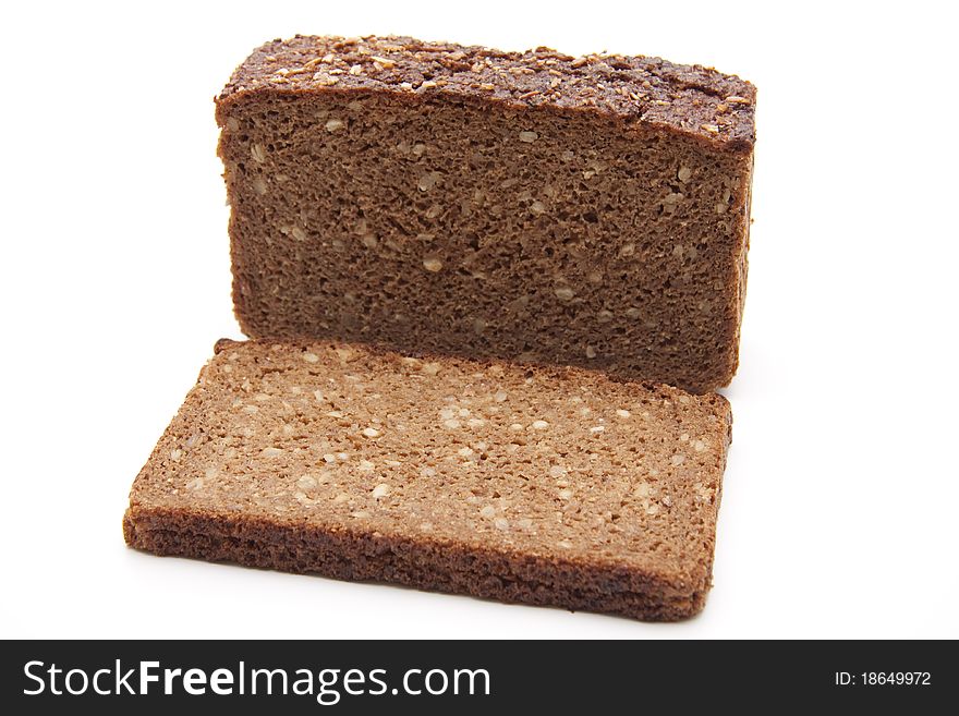 Wholemeal bread cut onto white background