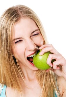 Lovely Girl Biting An Apple Royalty Free Stock Images