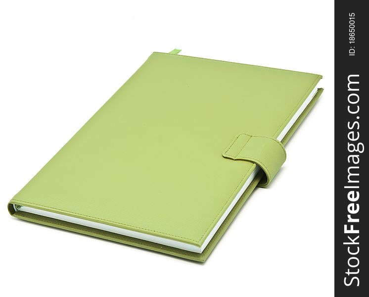 Green book on white background