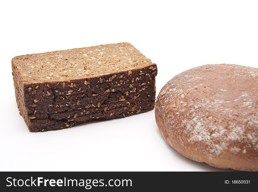 Wholemeal bread and wheat bread onto white background