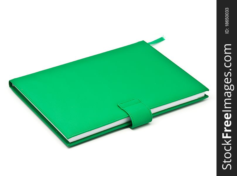 Green book on white background