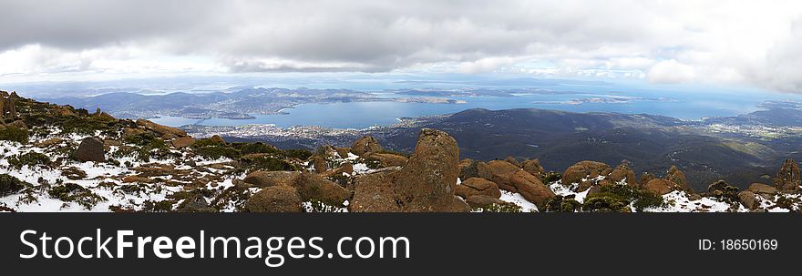 Panorama of Mount Wellington, Tasmania, with snow. The view below is of Hobart, the capital city. Panorama of Mount Wellington, Tasmania, with snow. The view below is of Hobart, the capital city.