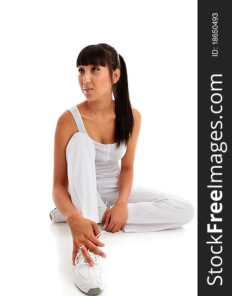 Woman Sitting Wearing Fitness Clothing.