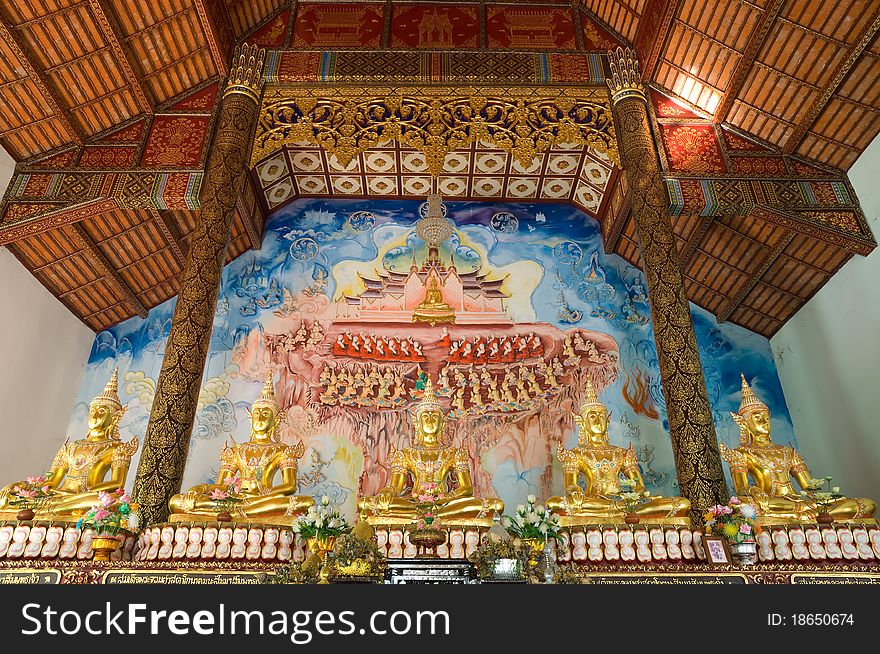 Beautiful image of buddha and mural at Wat Phra That Takpha Lamphun Province Thailand