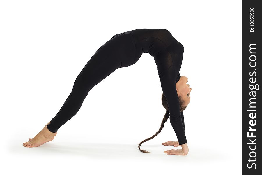 Studio photography of young professional gymnastic posing on white