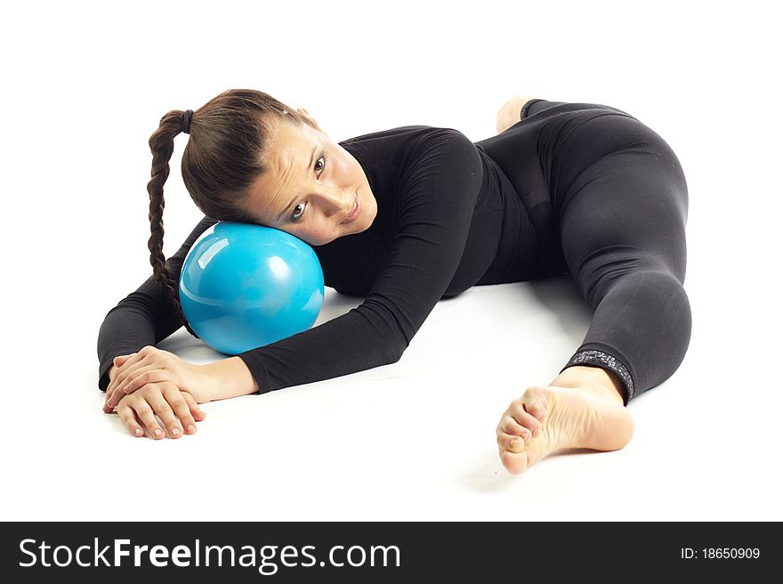 Studio photography of young professional gymnastic posing with blue boll on white background. Studio photography of young professional gymnastic posing with blue boll on white background