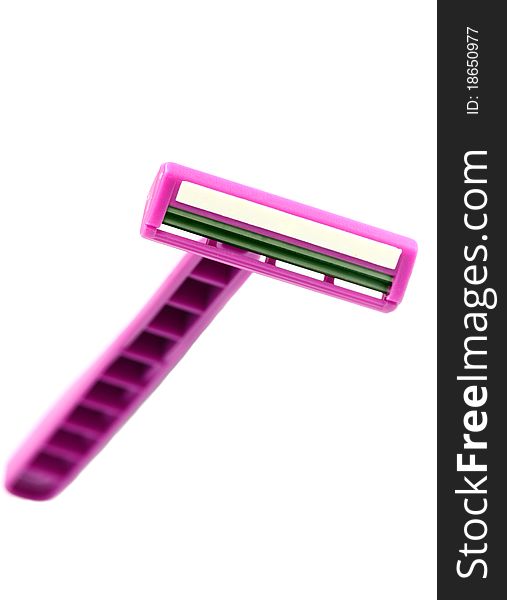 Isolated close-up pink safety razor. Isolated close-up pink safety razor