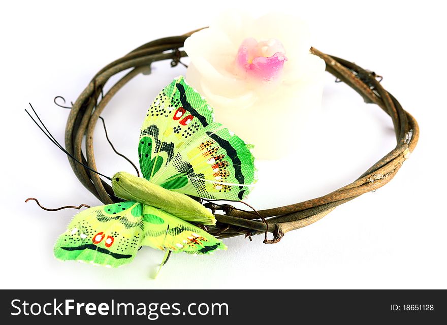 Isolated decoration set: candle and man-made butterfly. Isolated decoration set: candle and man-made butterfly