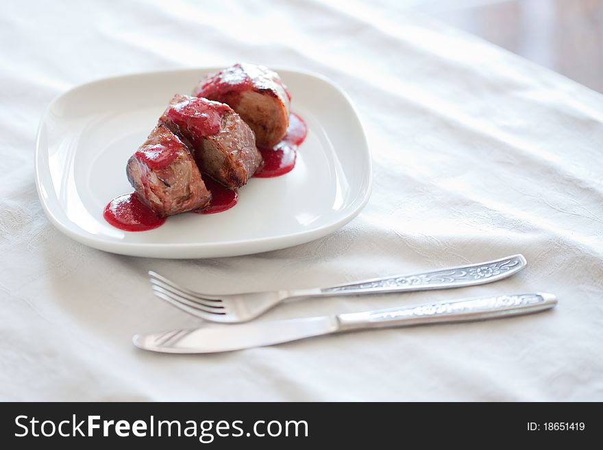 Dish from a pork cutting in sweet cherry sauce