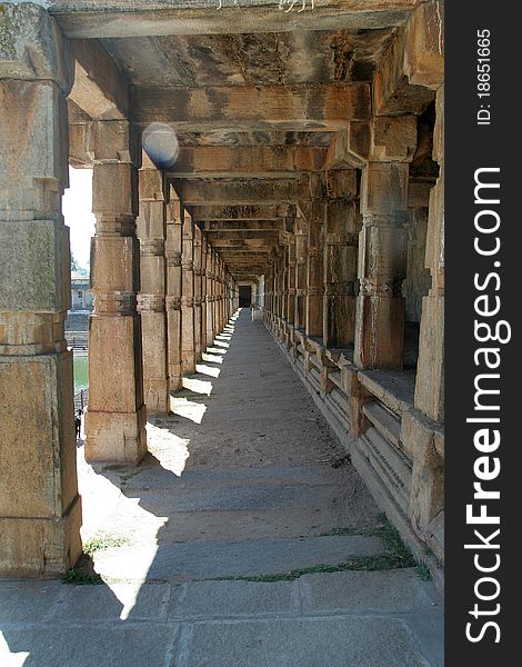 Perspective view of stone pillared corridor at Melkote, Karnataka, India, Asia