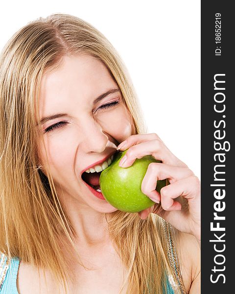 Lovely girl biting an apple expressively