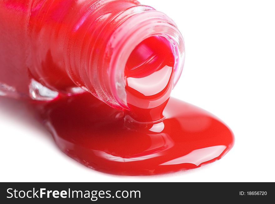 Red nail polish isolated on a white background