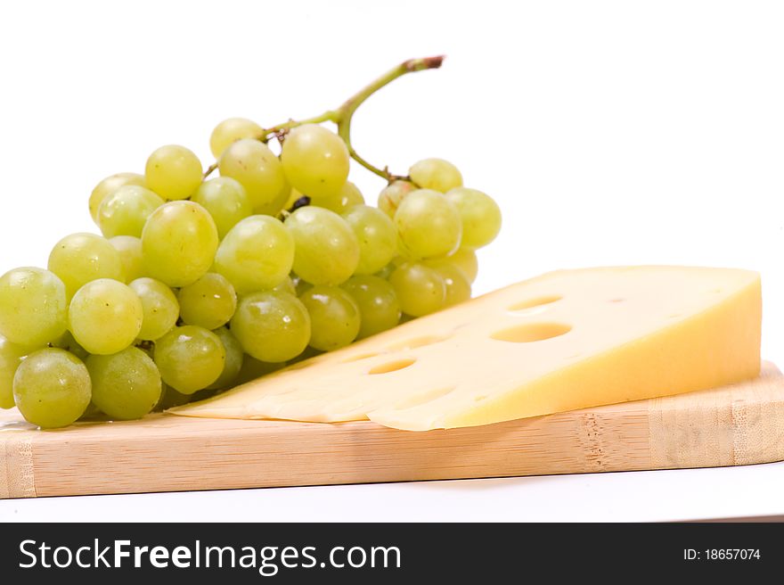 Still life with cheese and white grapes