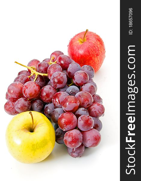 Grapes and apple on white background