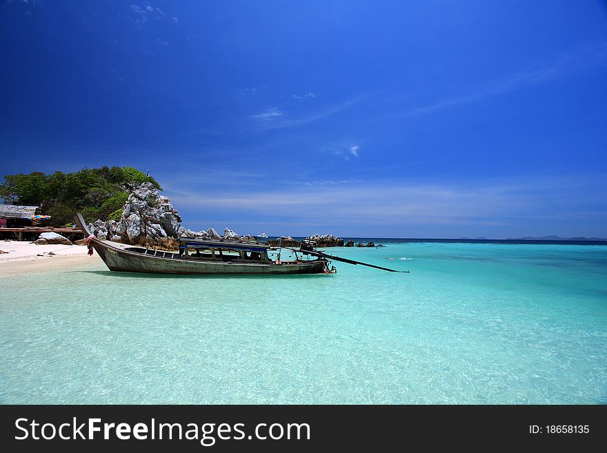A fisherman boat on the beautiful beach. A fisherman boat on the beautiful beach
