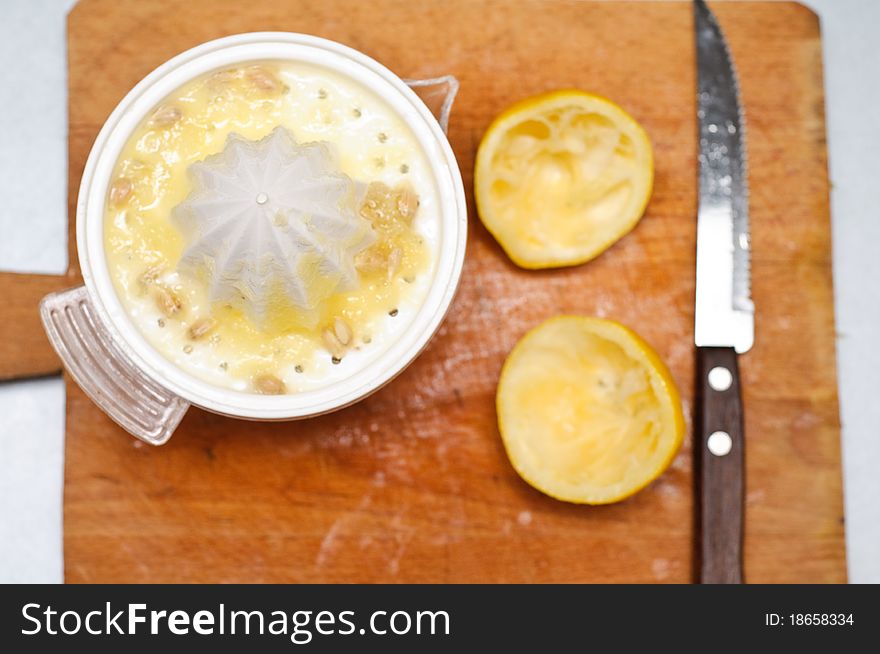 Squeezing juice from fresh lemons. Squeezing juice from fresh lemons