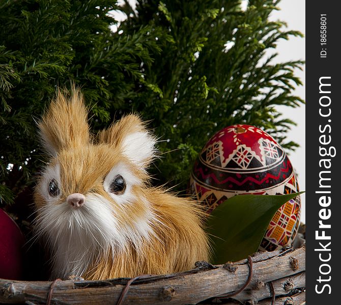 Easter bunny with traditional painted eggs