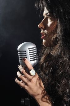 Brunette Beauty Singing With Retro Mic Royalty Free Stock Image