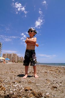 The Boy On A Beach Sunbathes. Royalty Free Stock Photography The Boy On A Beach Sunbathes. Royalty Free Stock Photography