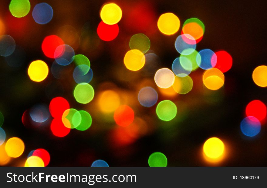 Multi-colored lights on a dark background to blur. Multi-colored lights on a dark background to blur