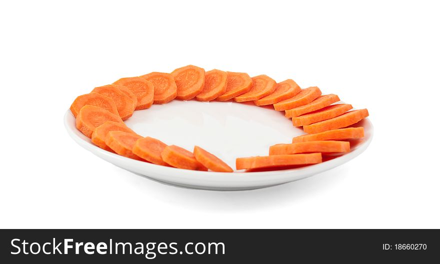 Carrots cut into circles on a white background