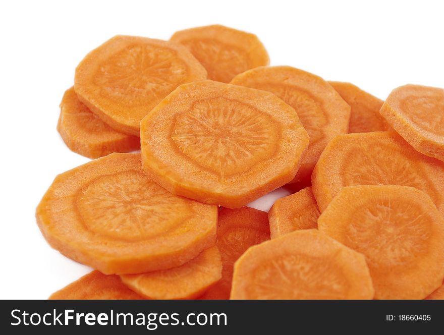 Carrots cut into circles on a white background