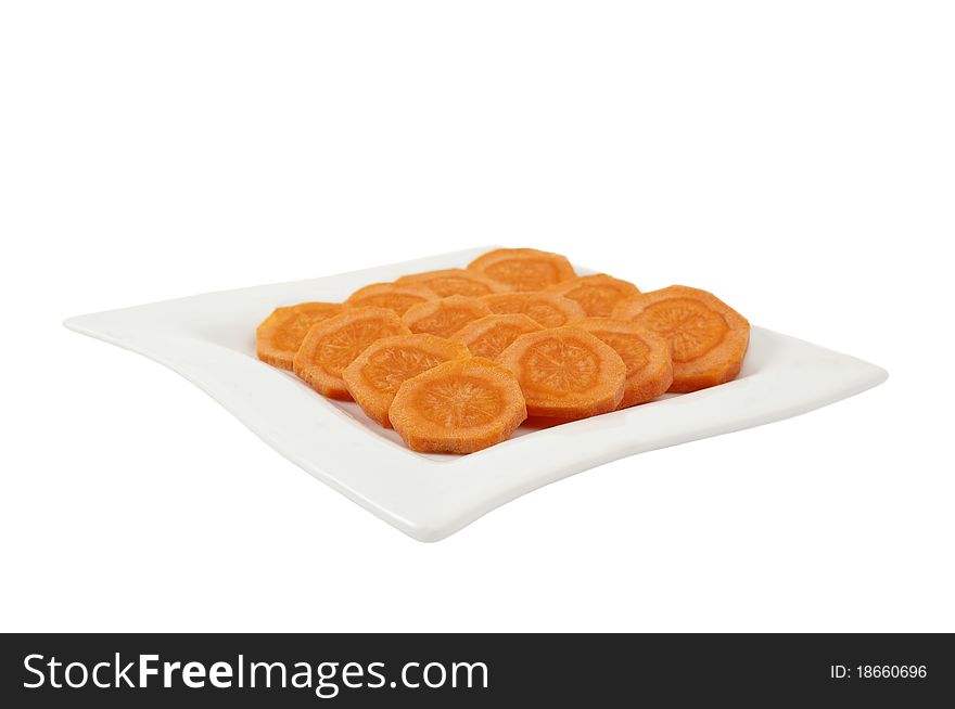 Carrots cut into circles on a white background