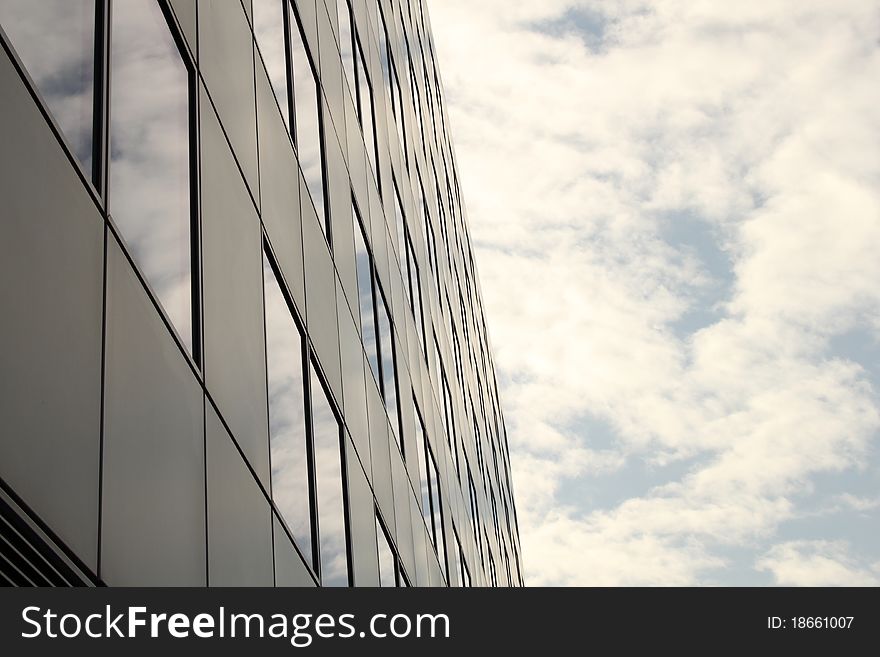 Modern business building, cloudy sky