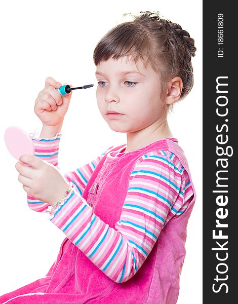 Young girl applies mascara. Isolated on a white background. Young girl applies mascara. Isolated on a white background.