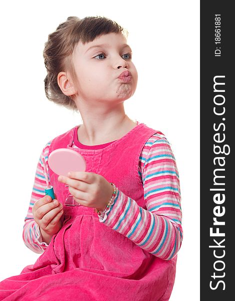 Young girl applies lipstick. Isolated on a white background. Young girl applies lipstick. Isolated on a white background.