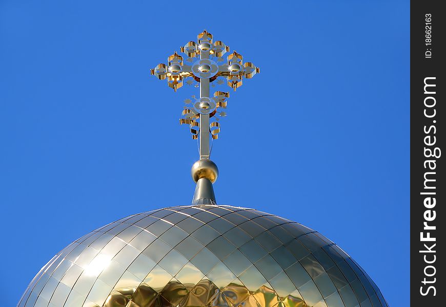 Gilded dome orthodox church on background blue sky