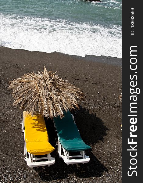 Sun Bed On A Black Beach