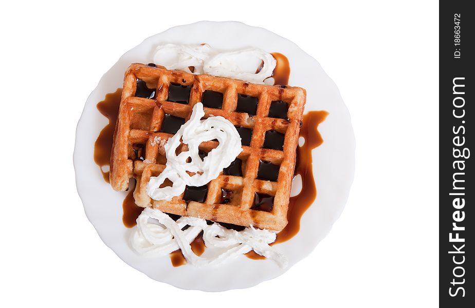 Waffle with caramel and cream isolated on white background