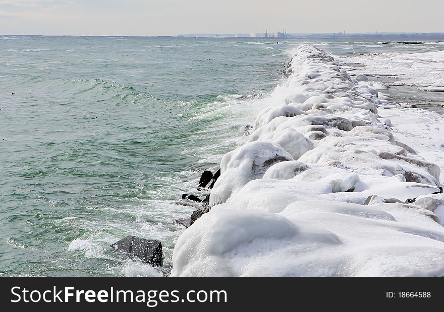 Huge ice covered stone breaker wall at the Toronto Islands