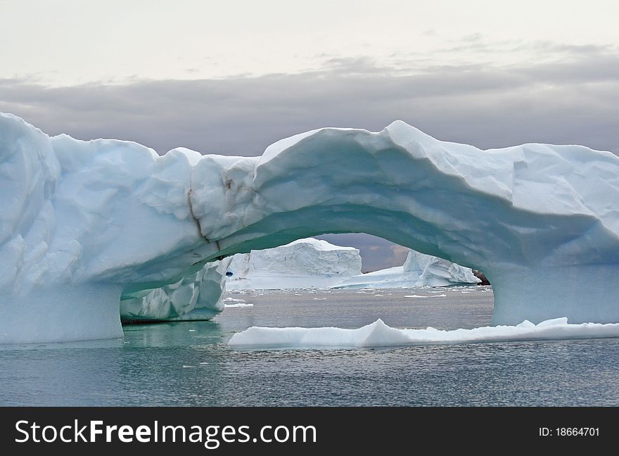Arch iceberg in Antarctica ocean. Arch iceberg in Antarctica ocean